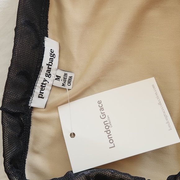 Black with nude liner mini skirt - Picture 2 of 3